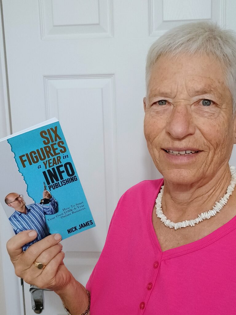 Jennifer Caroline holding Six Figures a Year Book